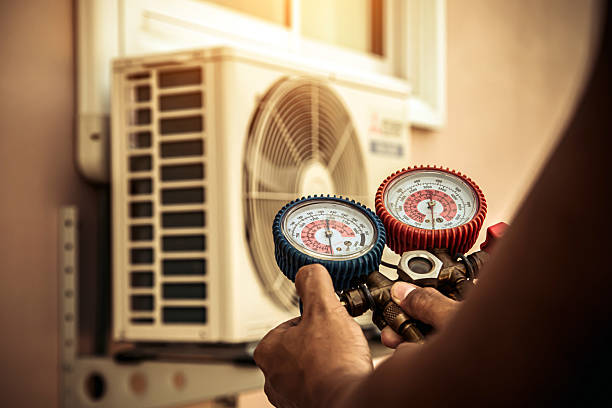Professional Air Conditioning Service technician working in Urbana, IN